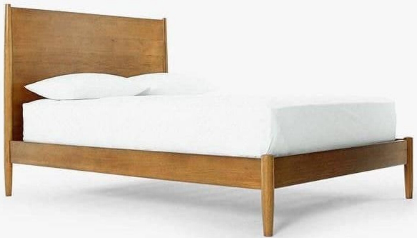 Wooden bed with white bedding