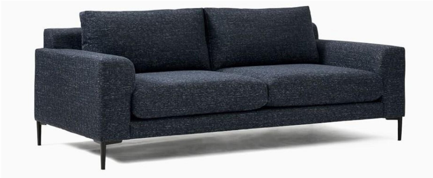 Beige three-seater sofa with colored pillows